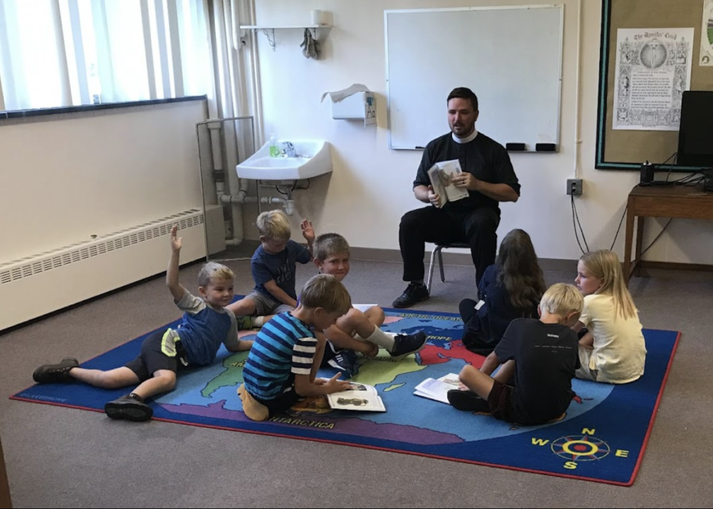 Pastor Koontz leading theology for the K-2 students